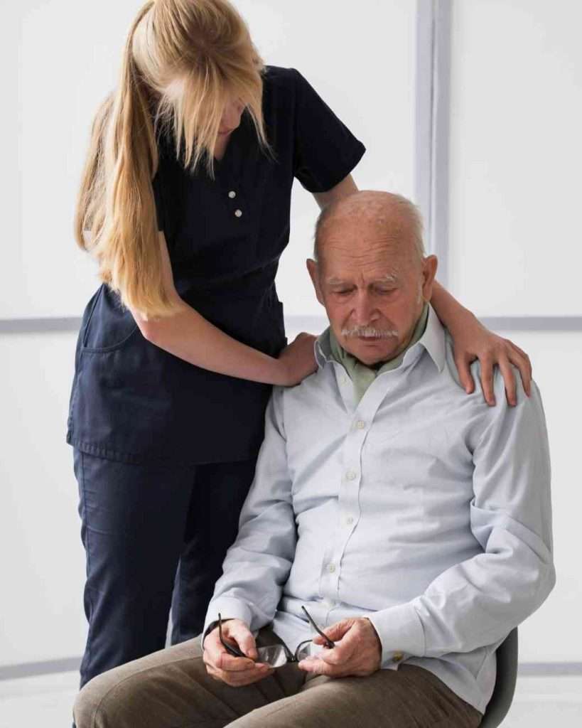 Caregiver providing emotional support to a senior.