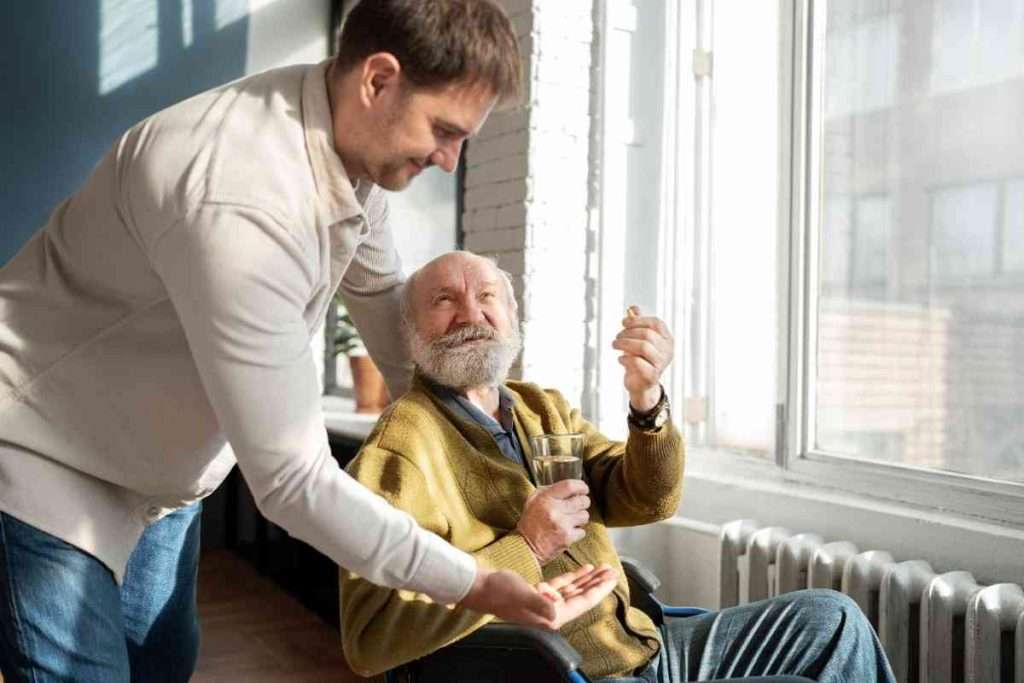 Caregiver assisting a senior with medication.