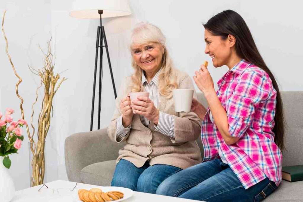 Caregiver providing emotional support to a senior.