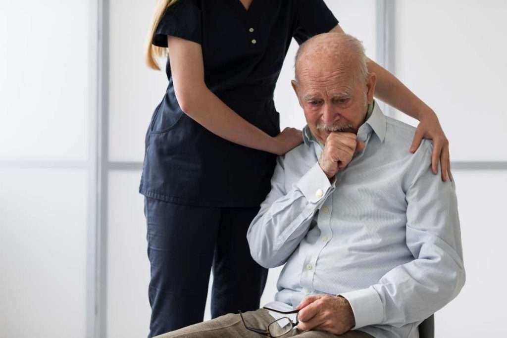 Caregiver providing support to a senior.